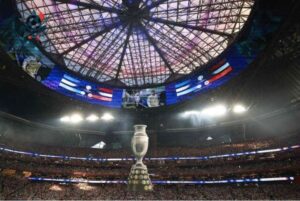  Không khí sôi động của Copa America 2026 với sân vận động rực sáng và hàng nghìn cổ động viên cuồng nhiệt cổ vũ cho đội tuyển yêu thích.